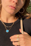 layered necklaces and rings