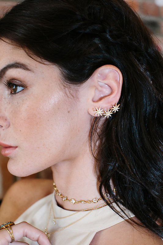 Gold multi star ear jacket