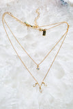 layered tiny gold diamond necklaces