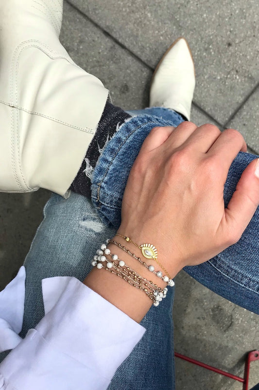 Evil Eye Slider bracelet layered with white howlite bracelet 