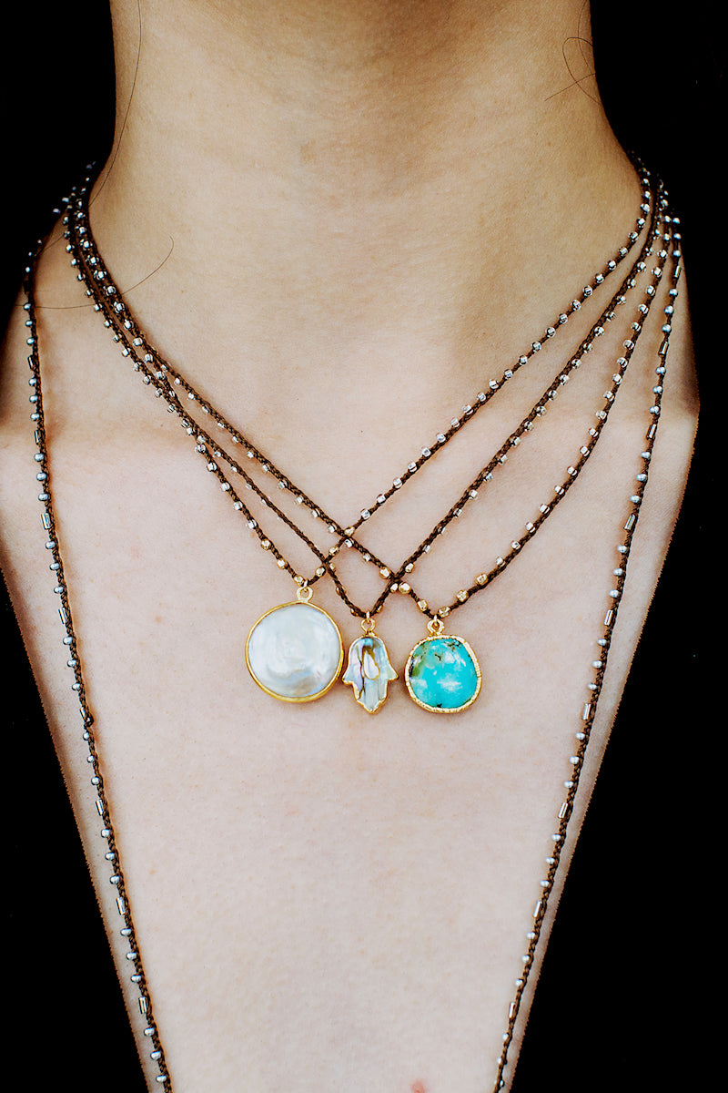 layered silk gemstone and shell necklaces 