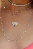 layered moonstone gold and silver necklaces 